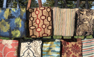 colorful bags created from salvaged upholstery fabric