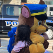 girl-being-hugged-by-howard-county-police-mascot